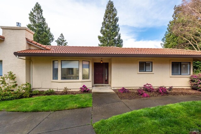 43 Fountain Grove Cir, Napa, CA 94558 - view of front facade with a tile roof, a front lawn, and stucco siding