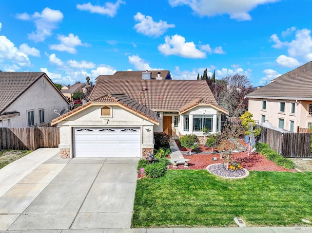 view of front of house with a tile roof, concrete driveway, stone siding, fence, and a garage