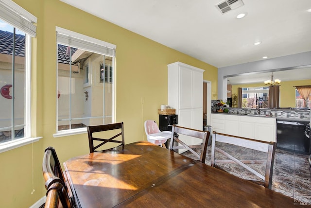 dining space featuring an inviting chandelier, visible vents, and recessed lighting
