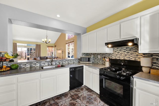 kitchen with tasteful backsplash, lofted ceiling, under cabinet range hood, and black appliances