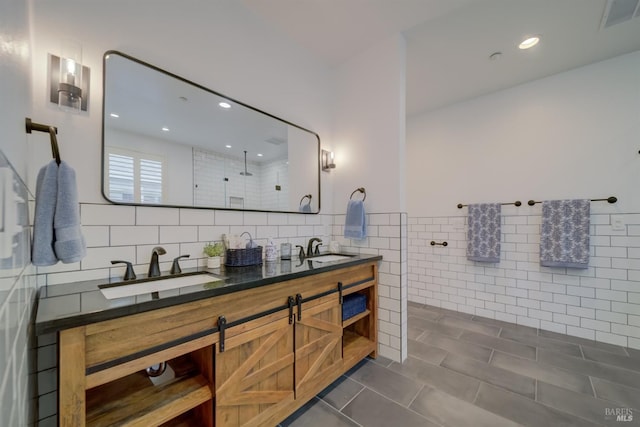 3982 Lucero St, Napa, CA 94558 - bathroom with tile walls, tile patterned floors, a walk in shower, double vanity, and recessed lighting