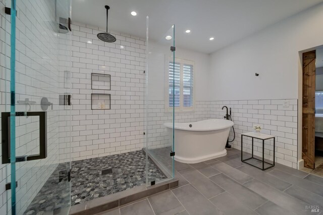 3982 Lucero St, Napa, CA 94558 - full bath featuring a freestanding bath, a stall shower, tile walls, recessed lighting, and wainscoting