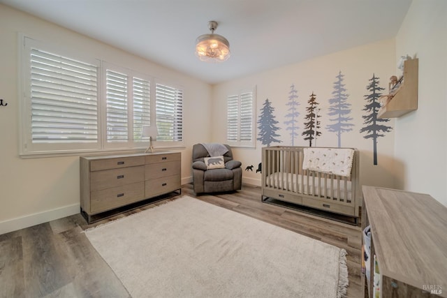 3982 Lucero St, Napa, CA 94558 - bedroom with wood finished floors, baseboards, and a nursery area