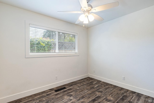 unfurnished room with a ceiling fan, dark wood-style flooring, baseboards, and visible vents
