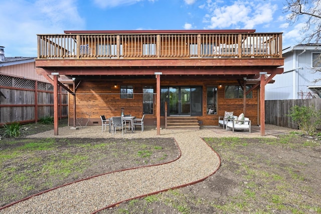 back of property featuring a fenced backyard, a patio area, and a wooden deck
