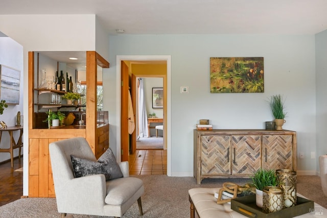 living room featuring baseboards and carpet