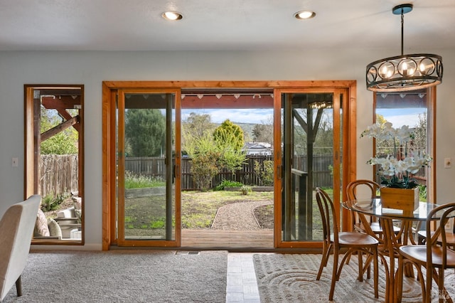 doorway featuring recessed lighting and a notable chandelier