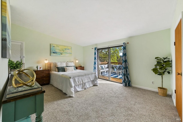 carpeted bedroom featuring access to outside, baseboards, and vaulted ceiling