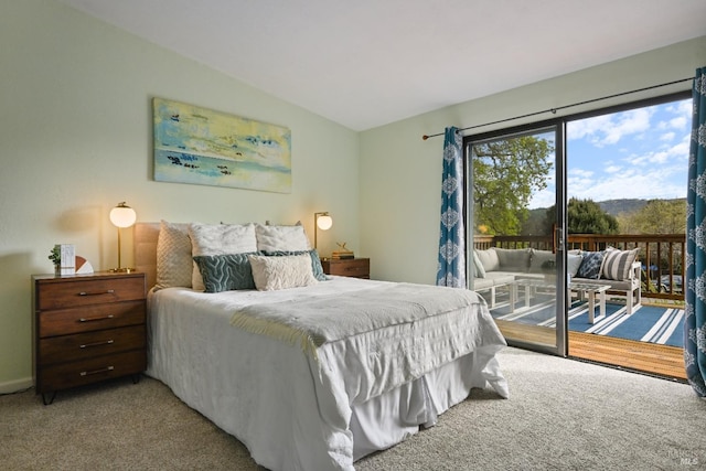 bedroom featuring carpet floors, vaulted ceiling, and access to exterior