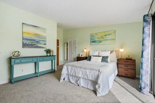 carpeted bedroom with baseboards