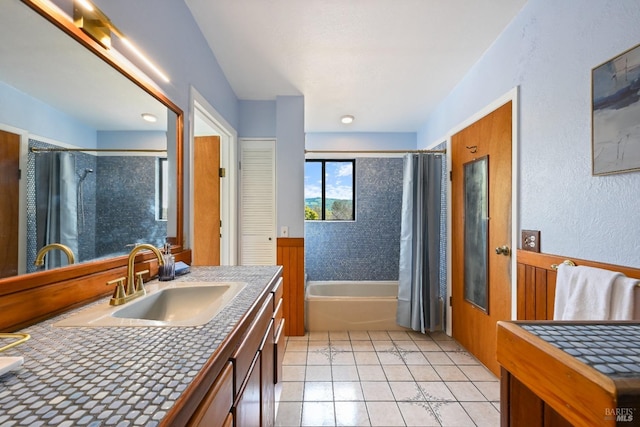 full bathroom featuring vanity, tile patterned floors, and shower / bath combo with shower curtain