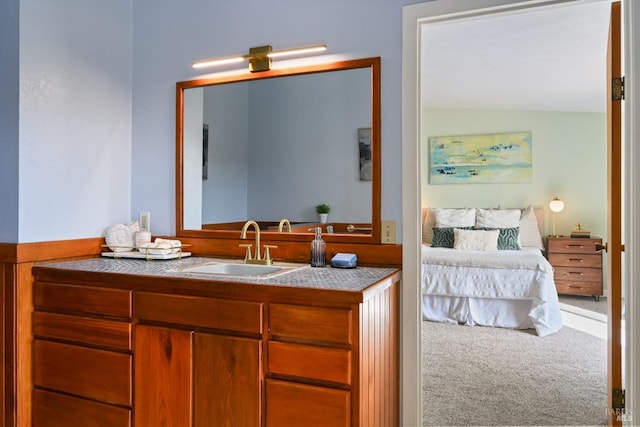 ensuite bathroom featuring vanity and connected bathroom