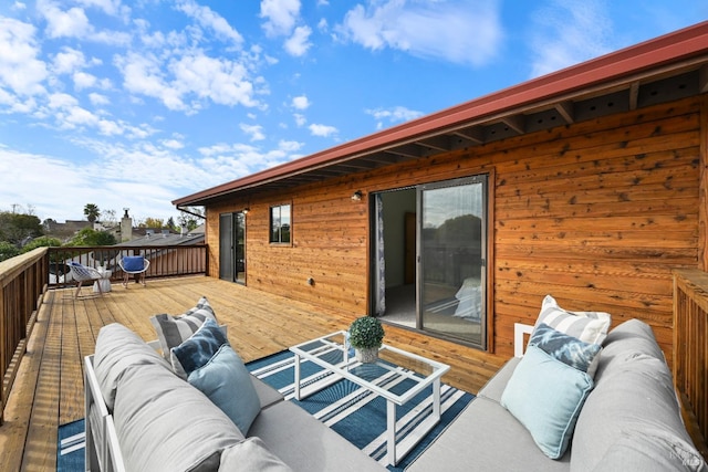 wooden deck with an outdoor hangout area