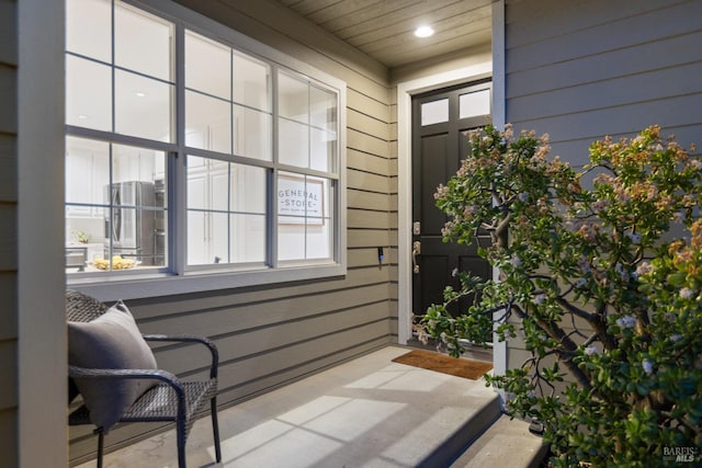 exterior space with wood ceiling, wooden walls, and recessed lighting