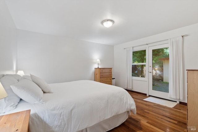 bedroom with wood finished floors and access to outside