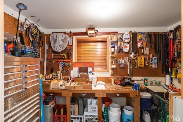 miscellaneous room with a workshop area