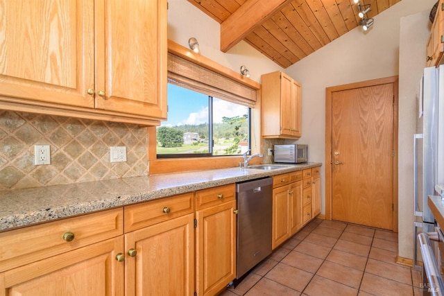 kitchen with lofted ceiling with beams, stainless steel appliances, tasteful backsplash, a sink, and light tile patterned floors
