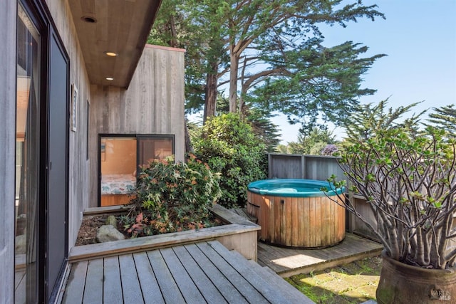 deck with a hot tub
