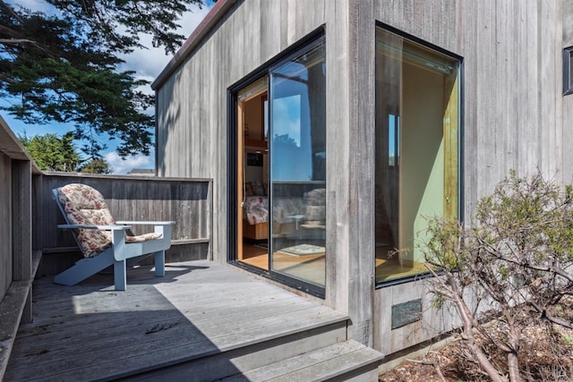 exterior space featuring a wooden deck and fence