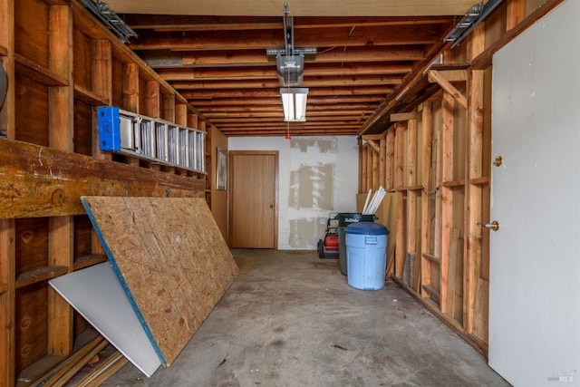 interior space with a garage and unfinished concrete floors