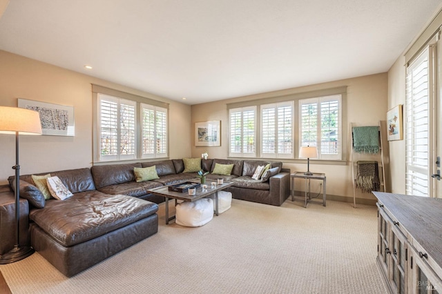 carpeted living room with recessed lighting, baseboards, and a healthy amount of sunlight