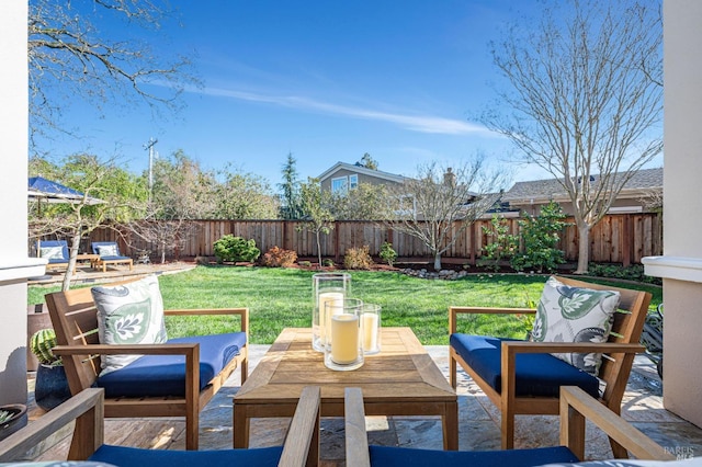 exterior space featuring an outdoor living space and a fenced backyard