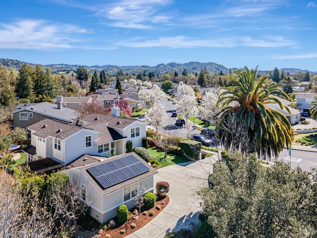 birds eye view of property with a mountain view and a residential view