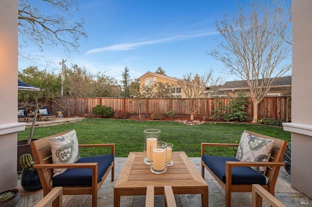 view of yard featuring outdoor lounge area, a fenced backyard, and a patio area