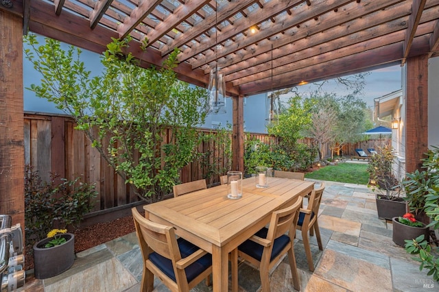 view of patio / terrace featuring a pergola, outdoor dining area, and a fenced backyard