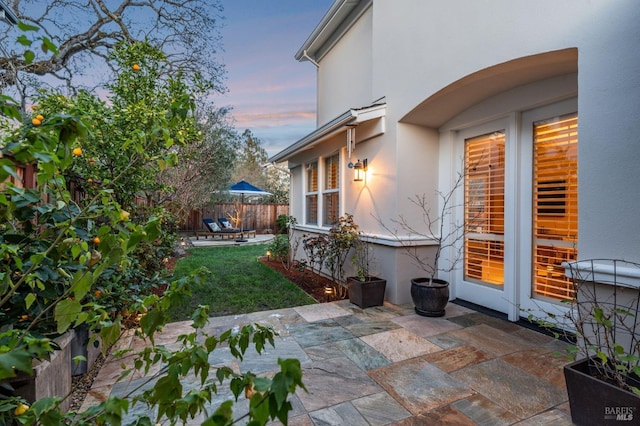 view of patio featuring fence