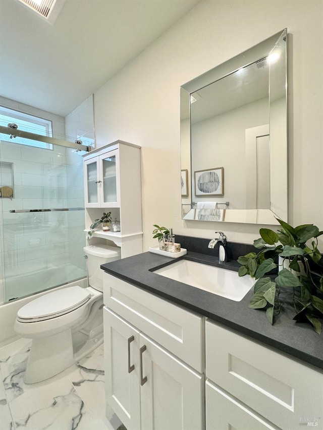2131 1st Ave, Napa, CA 94558 - bathroom with visible vents, toilet, marble finish floor, combined bath / shower with glass door, and vanity