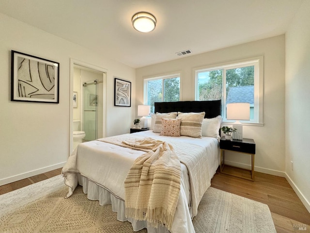 2131 1st Ave, Napa, CA 94558 - bedroom featuring visible vents, baseboards, ensuite bath, and wood finished floors