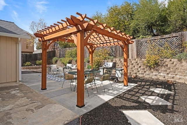 view of patio / terrace with outdoor dining area, a fenced backyard, and a pergola
