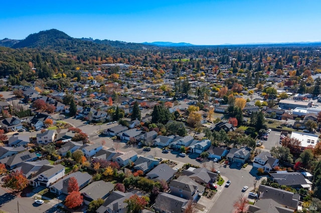 birds eye view of property with a mountain view and a residential view