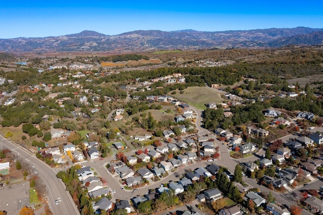 birds eye view of property with a mountain view and a residential view