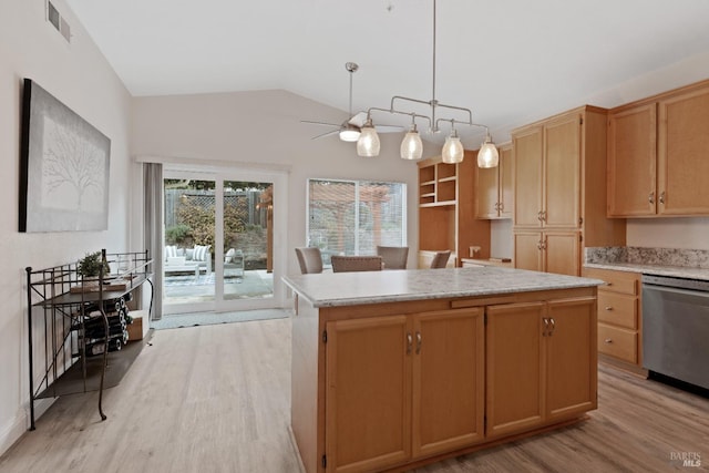 kitchen featuring light wood finished floors, visible vents, a center island, light countertops, and stainless steel dishwasher