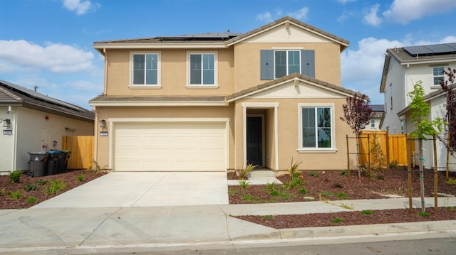 traditional home with fence, solar panels, and stucco siding