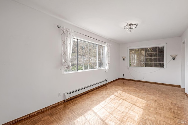 spare room with baseboards and baseboard heating