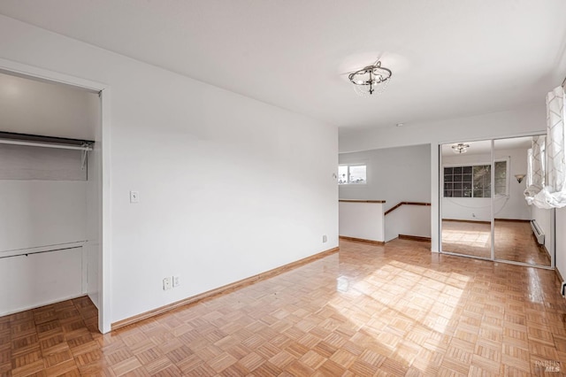 interior space featuring baseboards and baseboard heating