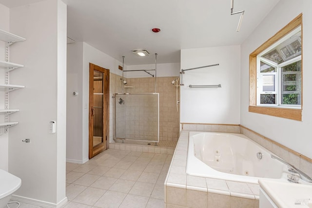 full bath featuring tile patterned flooring, baseboards, a stall shower, and a whirlpool tub