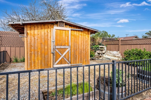 view of shed with fence