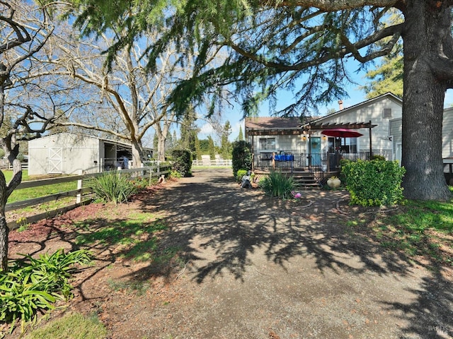 view of road featuring driveway and a gated entry