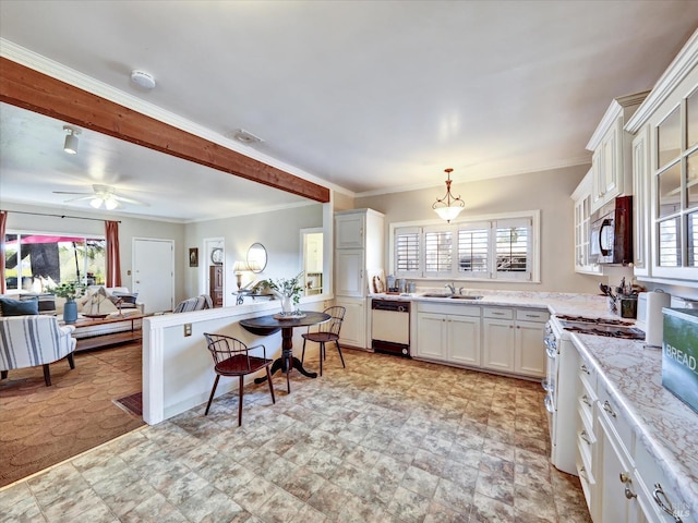 kitchen with white appliances, white cabinets, ornamental molding, and a sink