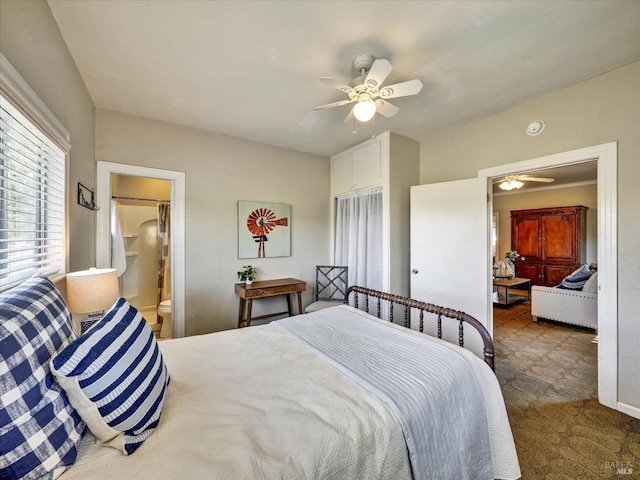 bedroom with carpet floors, ceiling fan, and ensuite bathroom