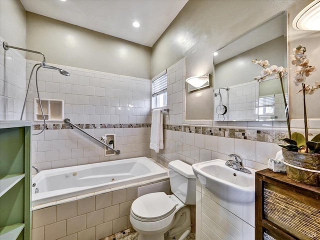 bathroom with toilet, tile walls, and vanity