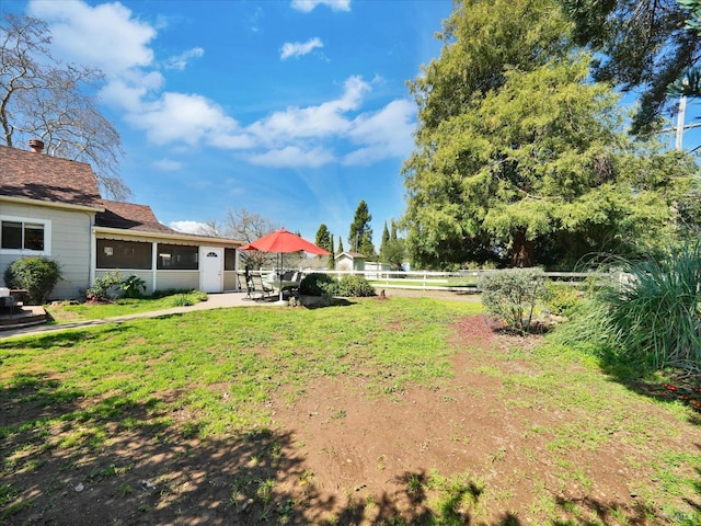 view of yard with fence and a patio area