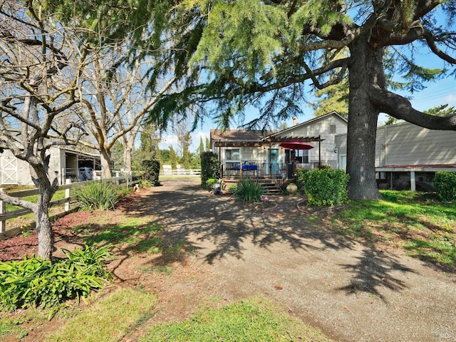 exterior space featuring a wooden deck and fence