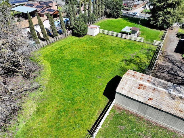 view of yard with an outdoor structure and fence