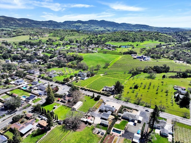 drone / aerial view featuring a mountain view and a rural view