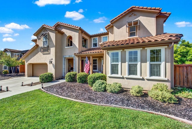 830 Elderberry Loop, Vacaville, CA 95688 - mediterranean / spanish-style home featuring fence, concrete driveway, stucco siding, and a tile roof